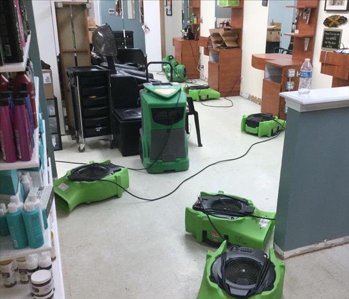 Drying equipment on a hair salon floor.